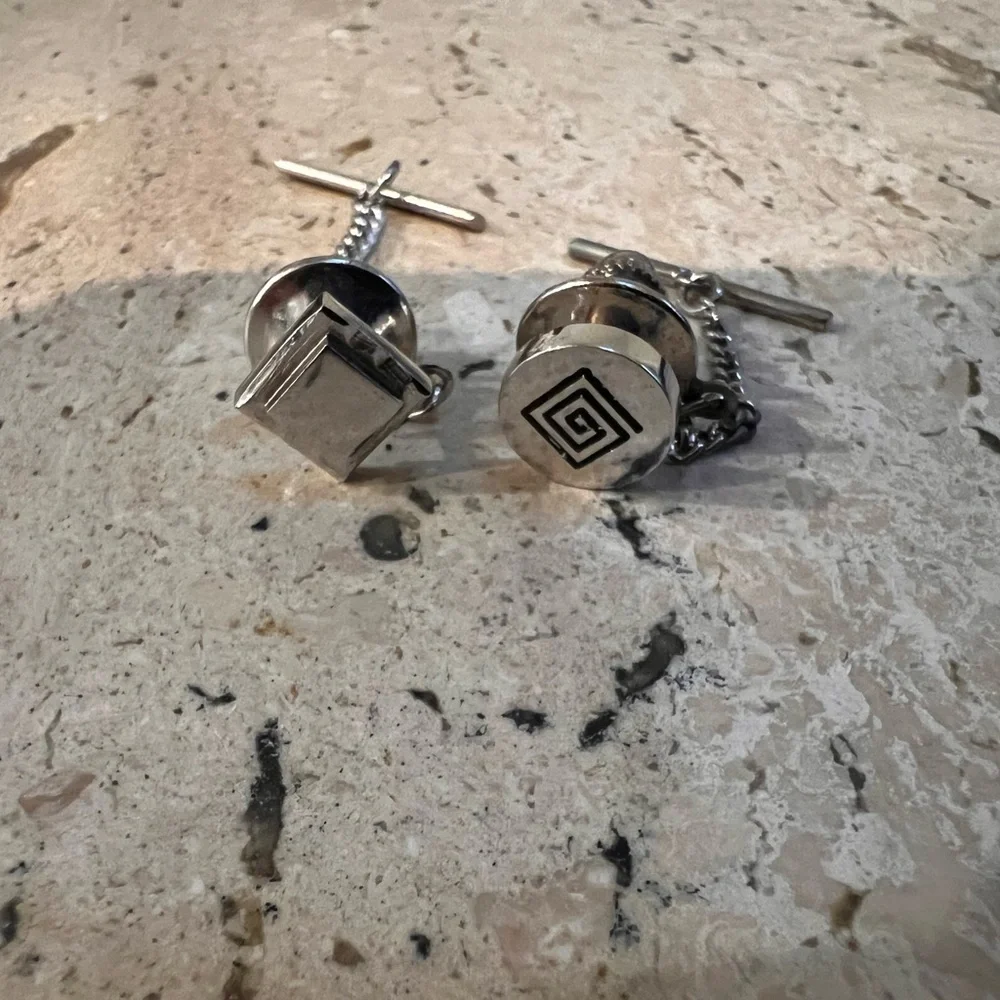 Two Silver Colored Tie Pins One Geometric Pattern One Shiny and Classy